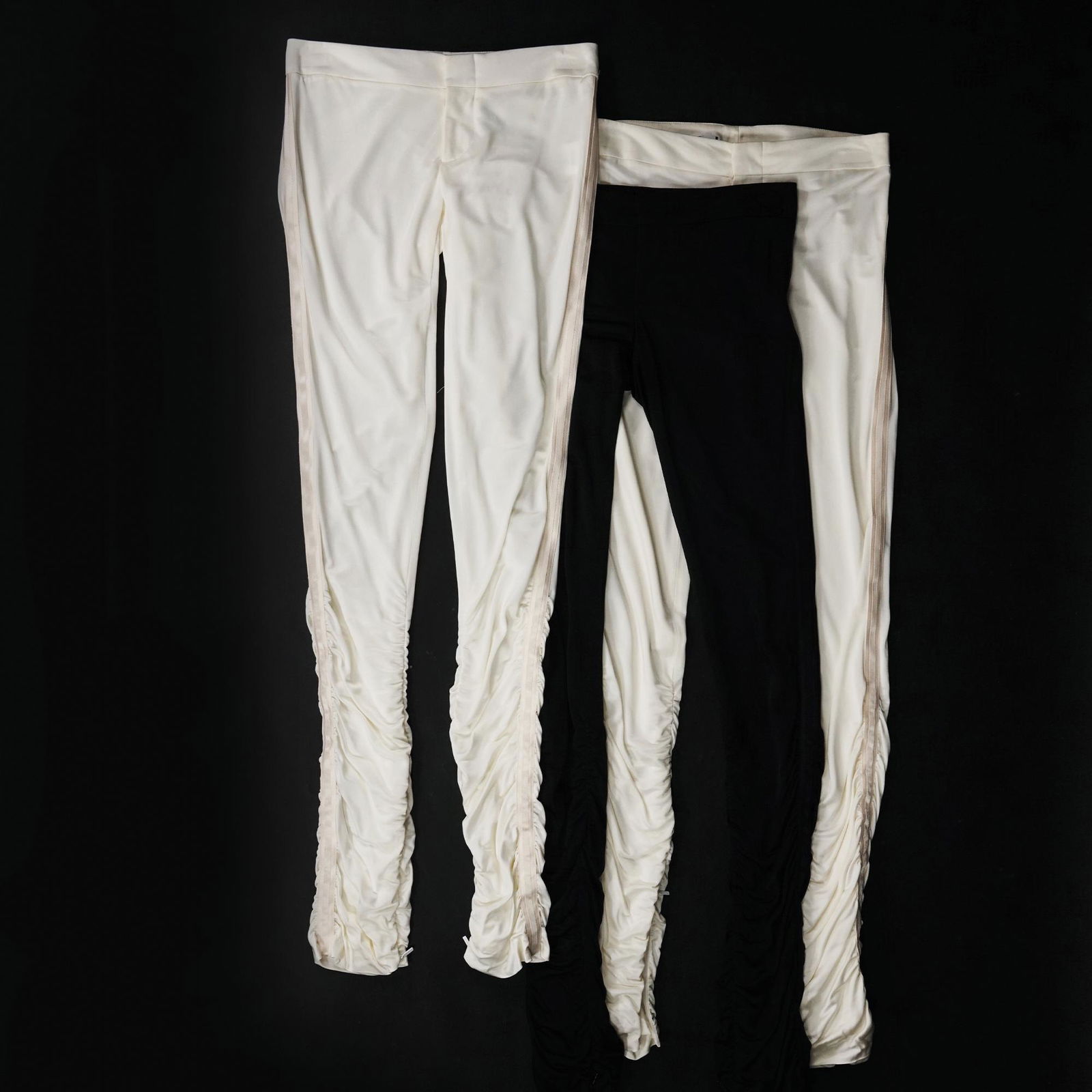 Gucci: 3 pairs of draped in silk jersey trousers, respectively in ivory color, size 38, black (new with tag), size 38 and white (new with tag), size 40