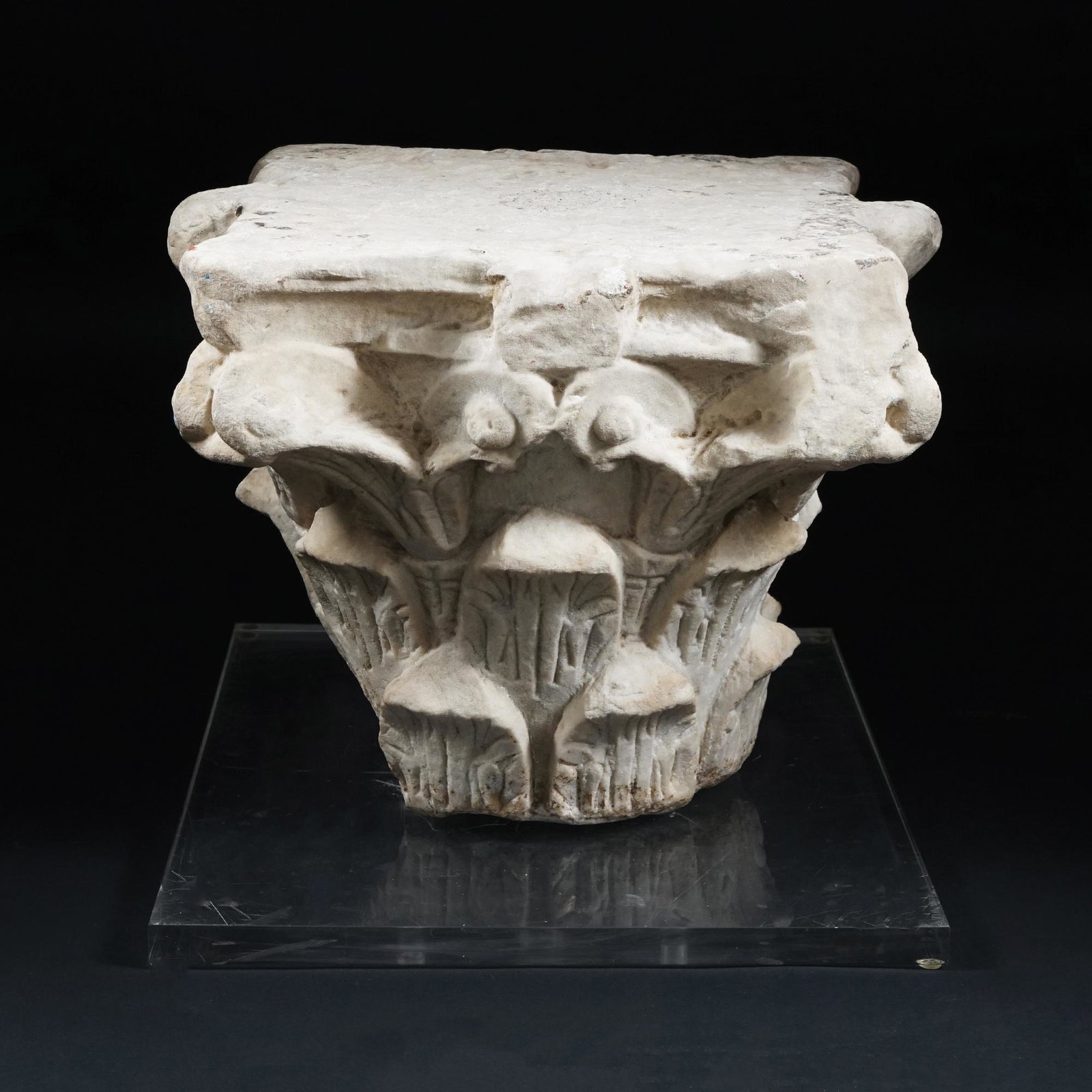 A carved white marble Corinthian capital with square plexiglas top, 18th century (1 of 1)