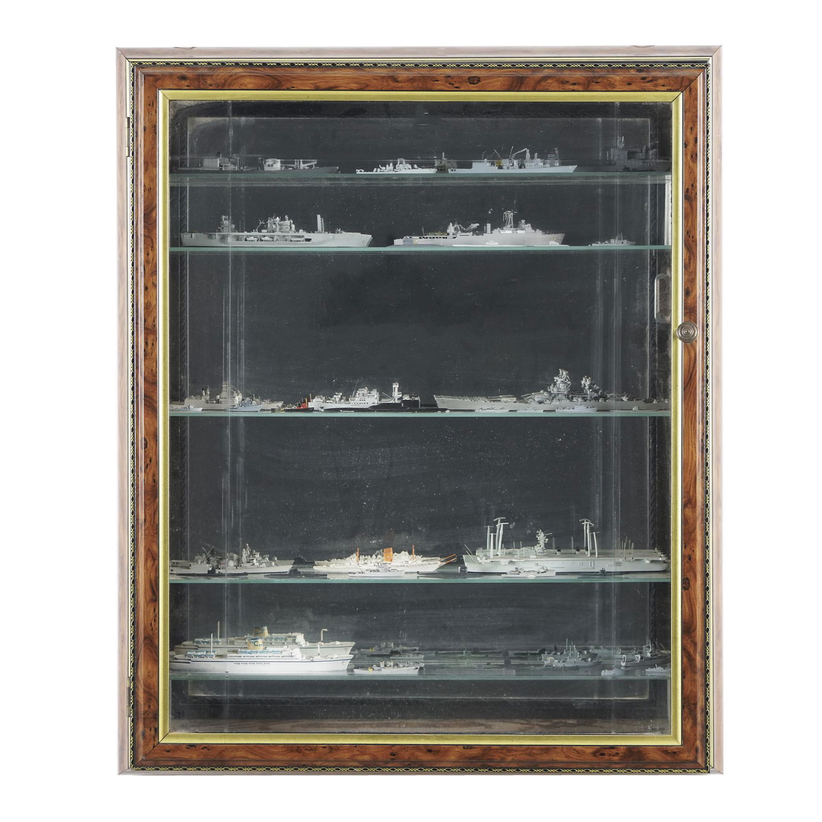 A wood wall display case: containing circa 47 lead military ship models, the case 9x59x49cm.