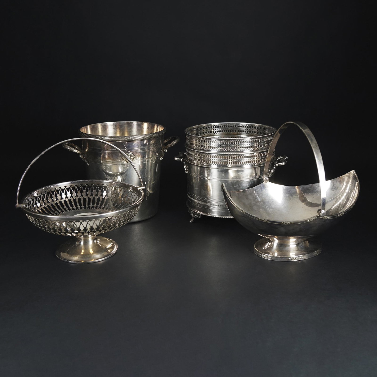 2 different silver metal wine coolers and 2 baskets: from 14x26x20cm. to 19by20cm.