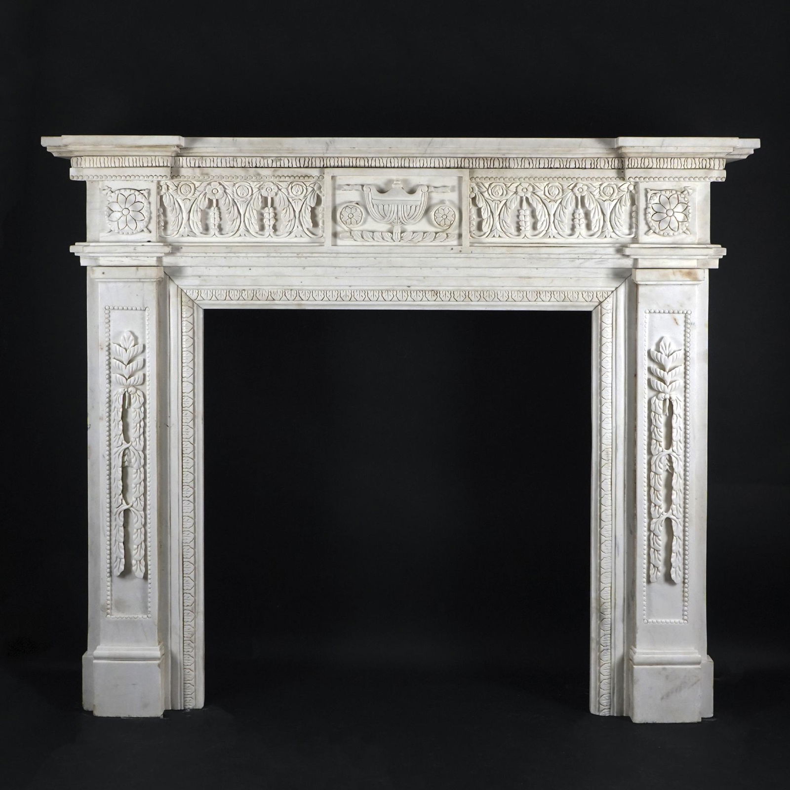 A white marble fireplace carved in Neoclassical style (1 of 1)