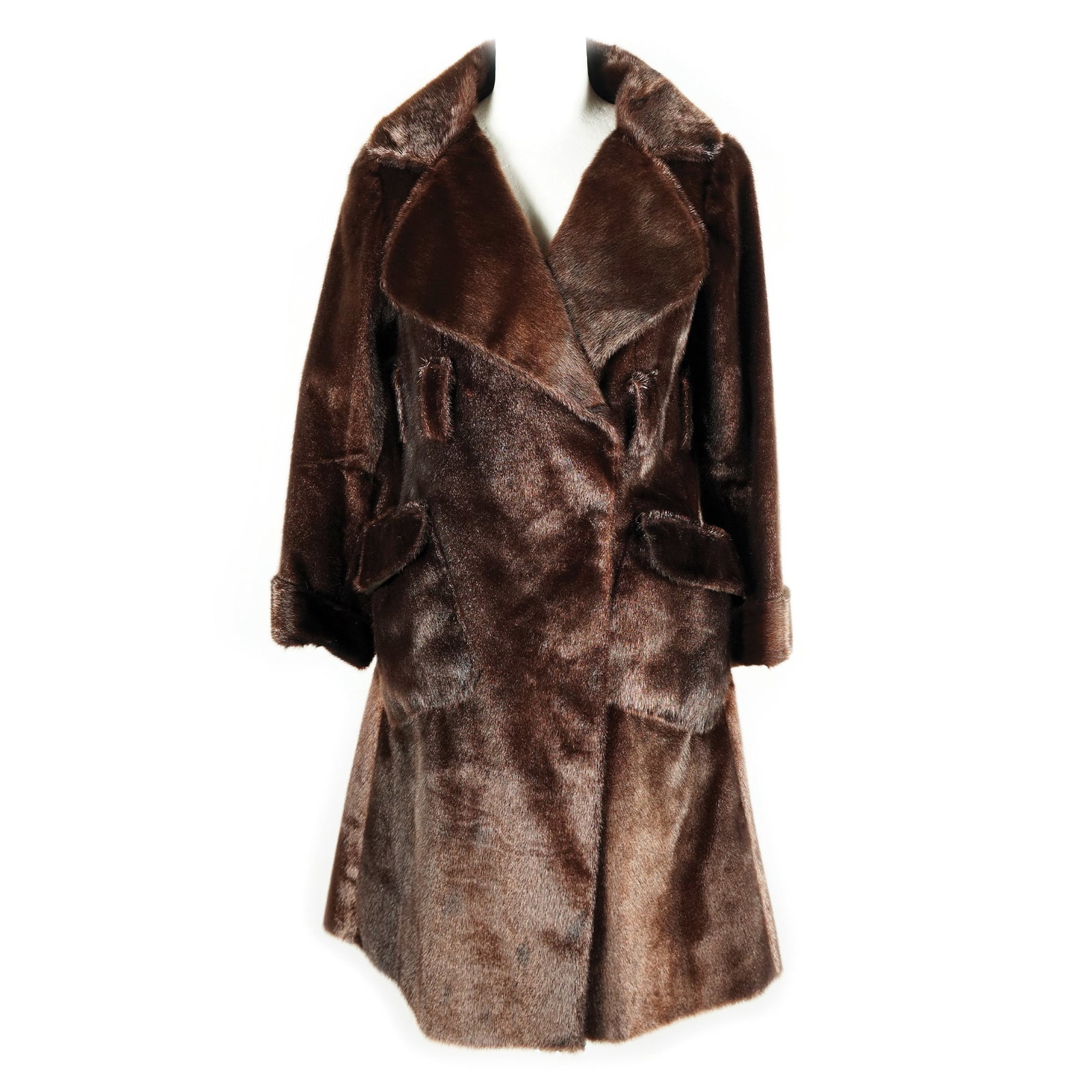 Pellegrini: a brown sealskin coat with patch pockets. '60s. Please note that each lot may have defects, stains or imperfections not noted in the catalog.