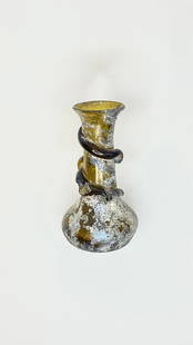 Ancient Roman Iridescent Glass Vessel: Title: Ancient Roman Iridescent Glass Vessel Medium: Glass Origin/Year: Rome, 6th-9th Century BC Dimensions: Height 15 cm Condition: Good; shows age-related wear Provenance: Historical artifact