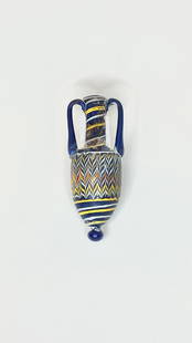 Ancient Phoenician Glass Amphora Vase: Title: Ancient Phoenician Glass Amphora Vase Origin/Year: Phoenicia, 2nd Century BCE Dimensions: Height: 13.5 cm, Width: 5.5 cm Condition: Excellent, with vibrant colors and no visible damage Provenan