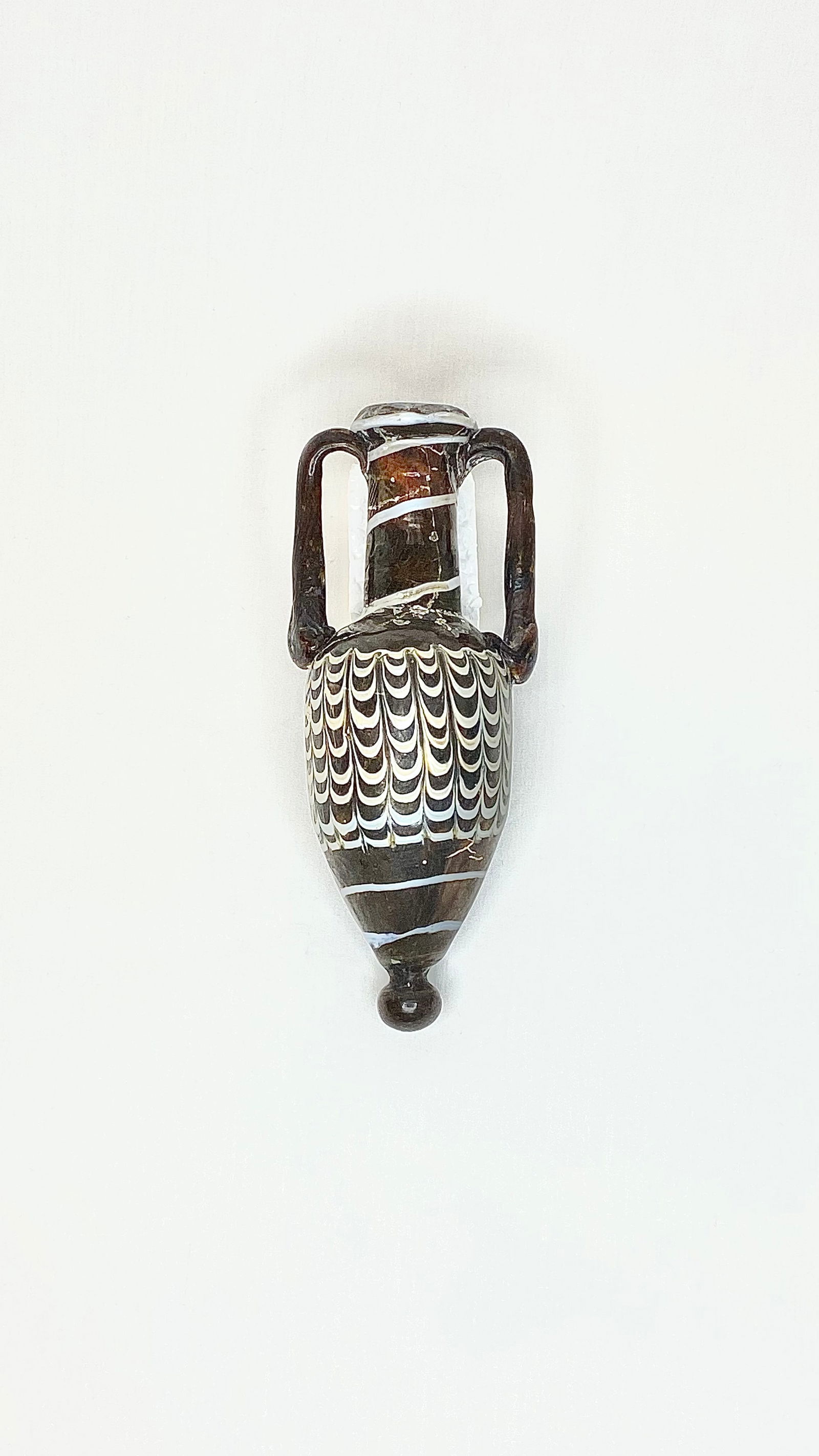 Ancient Phoenician Glass Amphora 2nd Century BC: Title: Ancient Phoenician Glass Amphora Medium: Glass Origin/Year: Phoenicia, 2nd Century BC Dimensions: Height: 14.2 cm, Width: 5.8 cm Condition: Excellent antique condition Provenance: Acquir