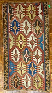 Kuba Kilim Rug, Caucasian, 1869, 5' x 10': Title/Medium: Kuba Caucasian Kilim Origin/Year: Caucasian, ca. 1869 or earlier Dimensions: 5 ft. x 10 ft. Condition: Signs of wear and damage indicative of age Provenance: Traditional craftsmanship