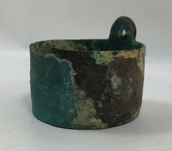 Bronze Roman Spatula 1st Millennium BC: Title: Bronze Roman Spatula Medium: Bronze Origin/Year: Roman, 1st Millennium BC Dimensions: Approximately cylindrical shape Condition: Weathered, with corrosion and minor damage Provenance: An