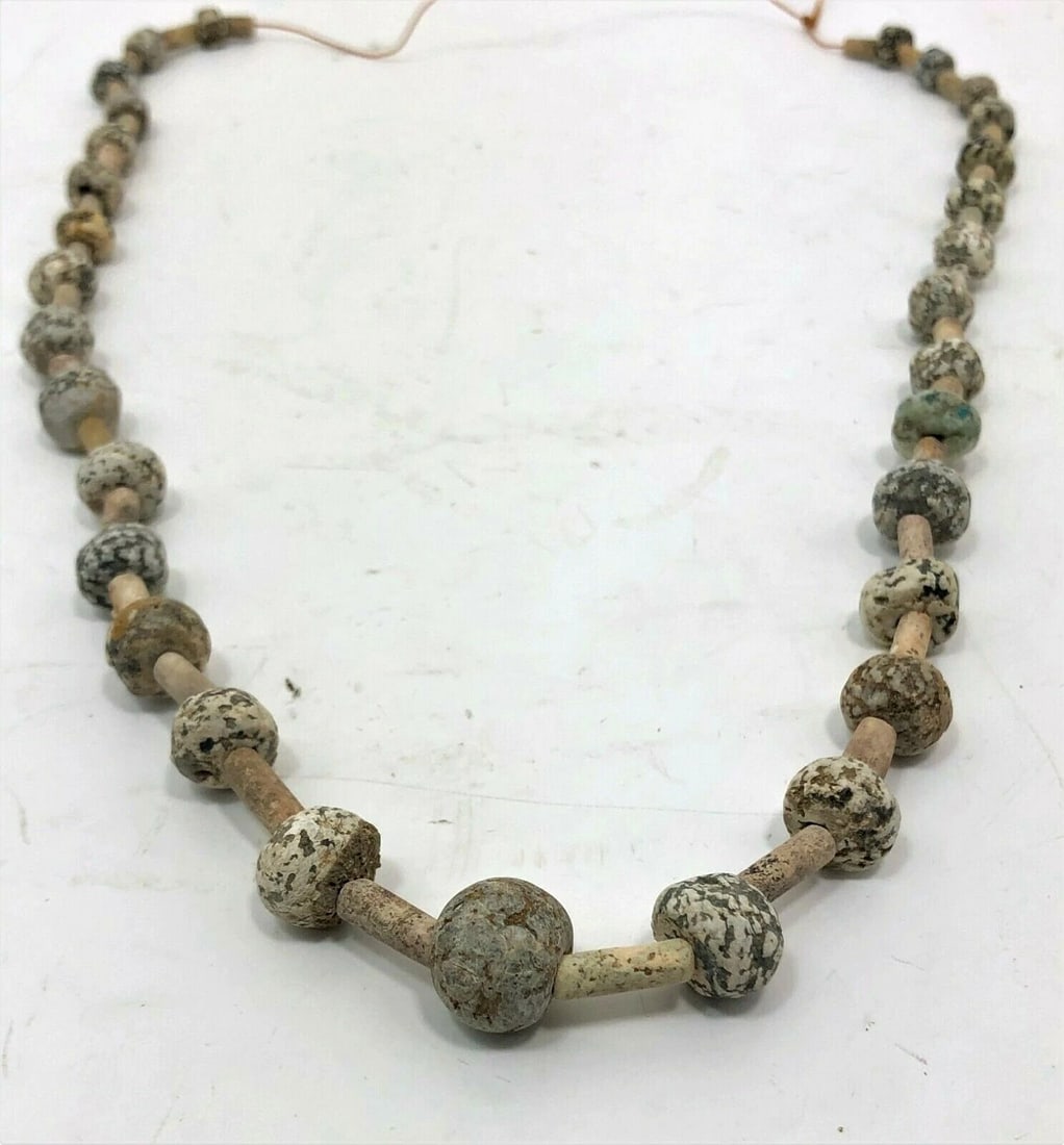 Ancient Spotted Stone & Faience Necklace: Title/Medium: Near Eastern Spotted Stone and Faience Necklace Origin/Year: Near East, I-II Millennium BC Dimensions: Length: 20 inches (approx.) Condition: Excellent condition with minor signs of age