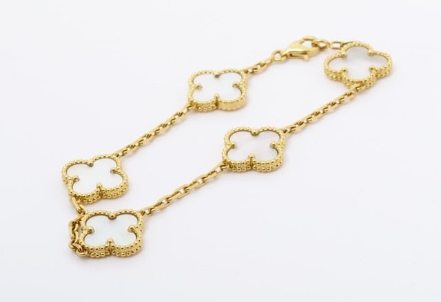 Van Cleef & Arpels Vintage Alhambra 5 Motifs White Mother of Pearl Gold Bracelet: Title/Medium: Van Cleef & Arpels Vintage Alhambra Bracelet Origin/Year: France, Early Model Dimensions: Standard bracelet size Condition: Very good pre-owned condition Provenance: Authenticated by Vic