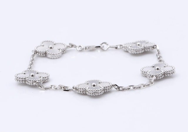 Van Cleef & Arpels Vintage Alhambra 5 Motif Guilloche 18K White Gold Bracelet: Title: Van Cleef & Arpels Vintage Alhambra 5 Motif White Gold Bracelet Medium: 18K White Gold Origin/Year: Van Cleef & Arpels Not specified Condition: Excellent pre-owned condition with minimal
