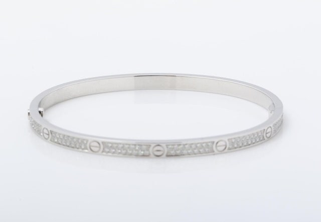 Cartier Love Diamond Paved Thin Model 18K White Gold Bangle Bracelet: Title/Medium: Cartier Love Diamond Thin Bracelet, 18K White Gold SIZE 17 Origin/Year: France, 2010-2019 Condition: Very good pre-owned condition. Please review all photos for full details. Provenance: