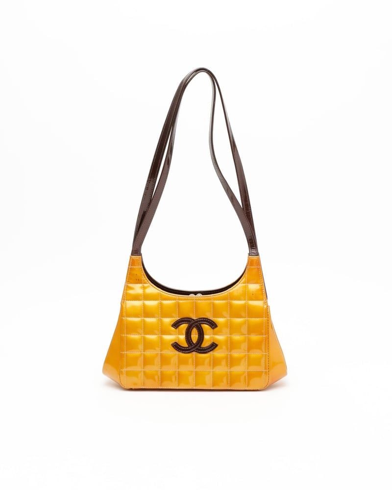 Chanel Vintage Chocolate Bar Patent Bag: Title/Medium: Chanel Chocolate Bar Patent Bag Origin/Year: Made in France, 2000-2002 Dimensions: Height: 20 cm Width: 28 cm Depth: 9 cm Shoulder Strap Drop: 34 cm Condition: Ve