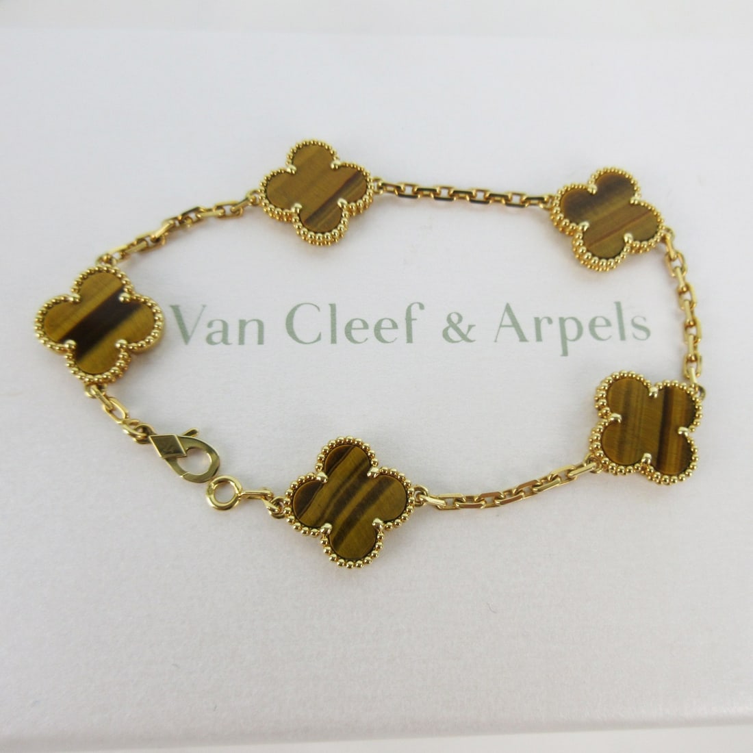Van Cleef & Arpels Vintage Alhambra Tiger's Eye 5 Motif 18K Yellow Gold Bracelet: Title/Medium: Van Cleef & Arpels Vintage Alhambra Tiger's Eye 5 Motif 18K Yellow Gold Bracelet Origin/Year: France, 2015-2024 Dimensions: Not specified Condition: Estate pre-owned. Very good