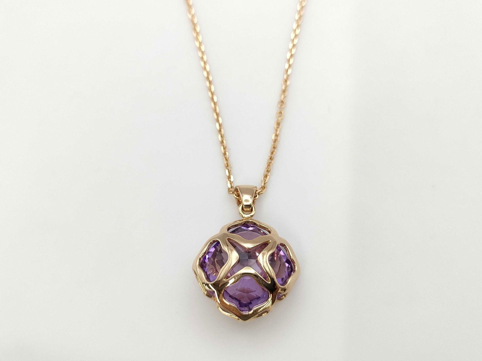 Chopard Imperiale Amethyst 18K Rose Gold Pendant Necklace: Elegant Chopard Imperiale necklace crafted in solid 18K rose gold, featuring a sculptural pendant set with vibrant natural amethyst gemstones in the collection's distinctive architectural openwork des
