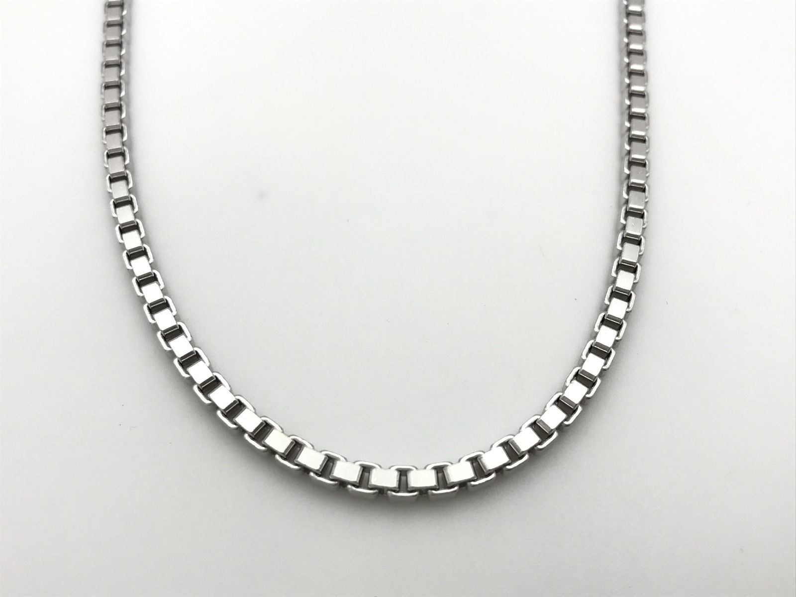18K White Gold Box Chain Vintage Link Necklace: Description: Elegant and substantial box chain necklace crafted in solid 18K white gold, featuring a refined geometric link construction that provides both durability and fluid movement. The clean mod