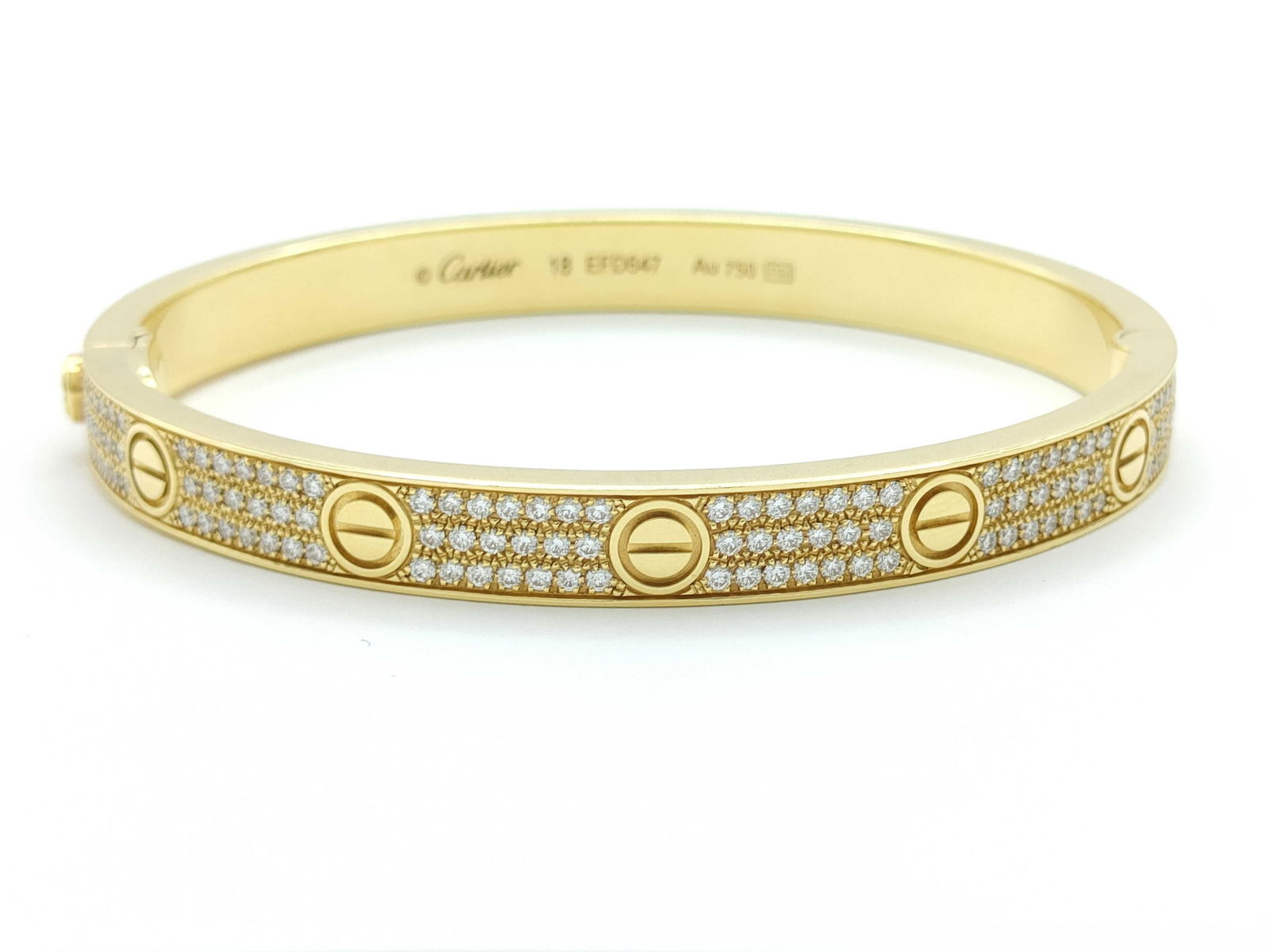 Cartier Love Collection Diamond Pave 18K Yellow Gold Bangle Bracelet: Description: This iconic Cartier Love Collection bangle bracelet is crafted in solid 18K gold and features a full pave diamond design that creates exceptional brilliance and timeless elegance. The sig