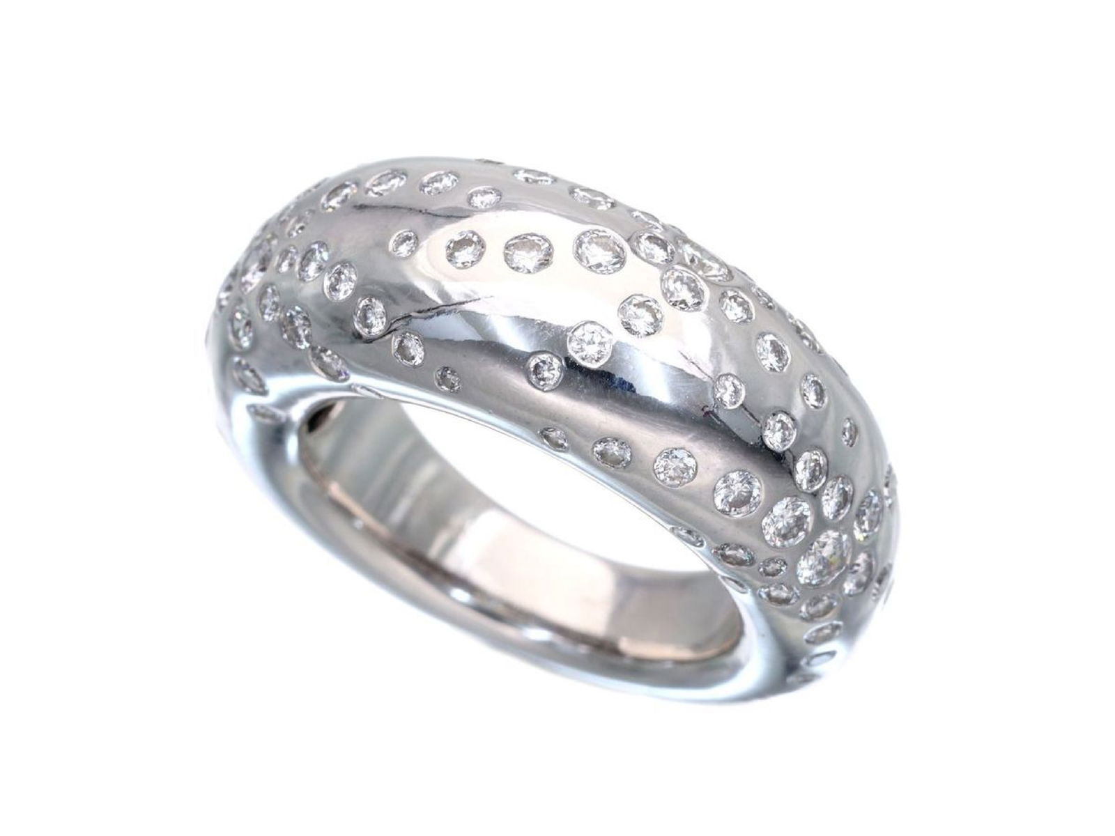 Chaumet Anno Fire Works Diamond 18K White Gold Ring: Description: This elegant Chaumet Anno Fire Works ring is crafted in solid 18K white gold and features brilliant diamond accents set throughout a smooth, sculptural domed band. The distinctive flowing