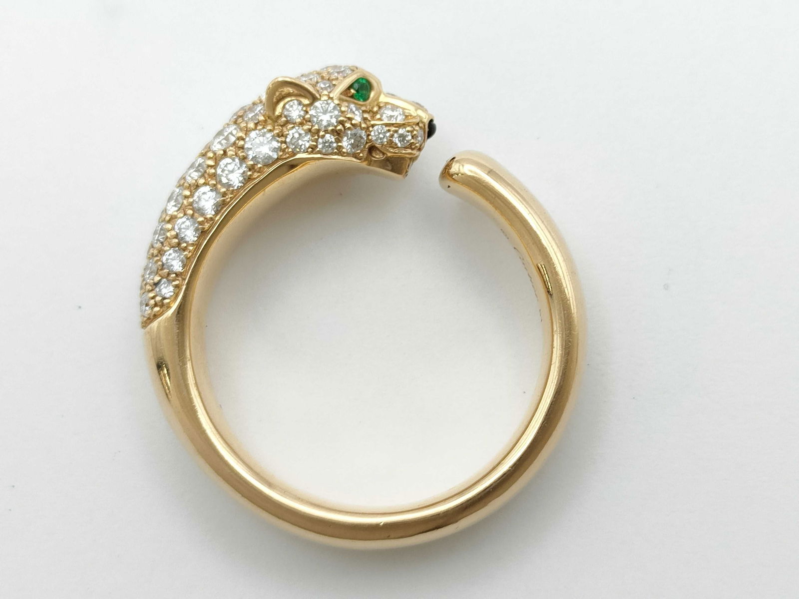Cartier Panther Diamond Pave 18K Yellow Gold Ring: Description: This exceptional Cartier Panth?re ring is crafted in solid 18K gold and features the iconic panther motif, fully set with brilliant pave diamonds that create remarkable brilliance and dim