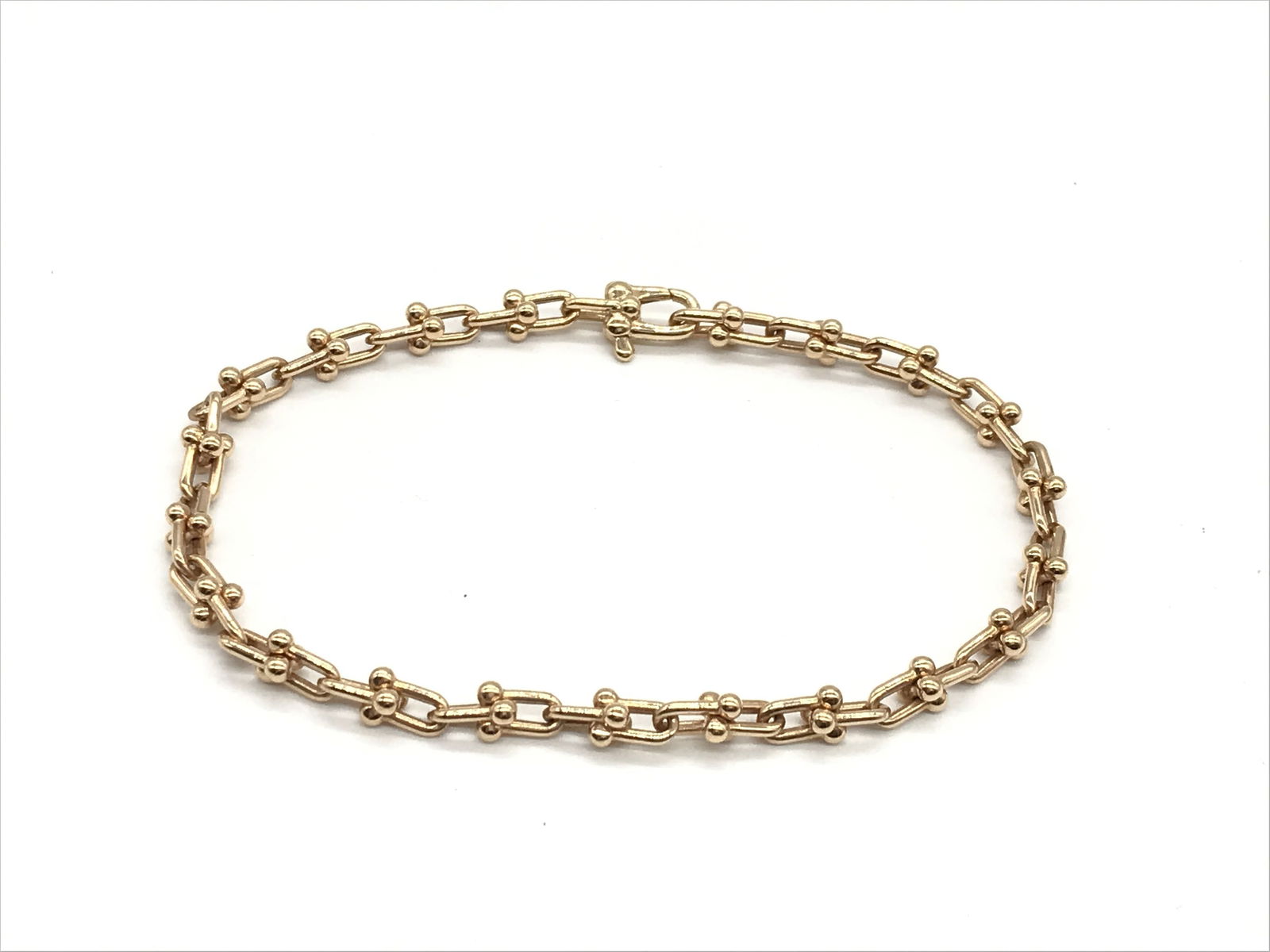 Tiffany & Co. HardWear Micro Link 18K Rose Gold Bracelet: Elegant Tiffany & Co. HardWear Micro Link bracelet crafted in solid 18K rose gold. The bracelet features the collection's signature micro link chain design, combining modern industrial inspiration wit