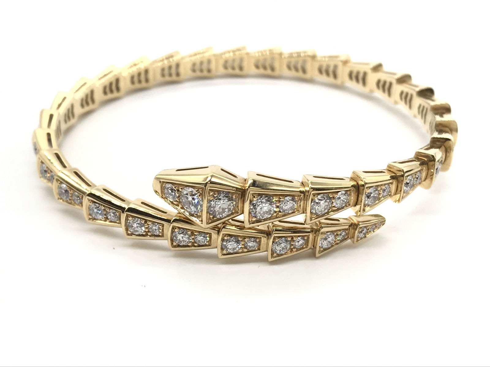 Bulgari Serpenti Viper Snake Diamond 18K Yellow Gold Bracelet Bangle: This elegant Bulgari Serpenti Viper bangle bracelet is crafted in solid 18K gold and features the iconic serpent motif, set throughout with brilliant pave-set diamonds that create exceptional brillian