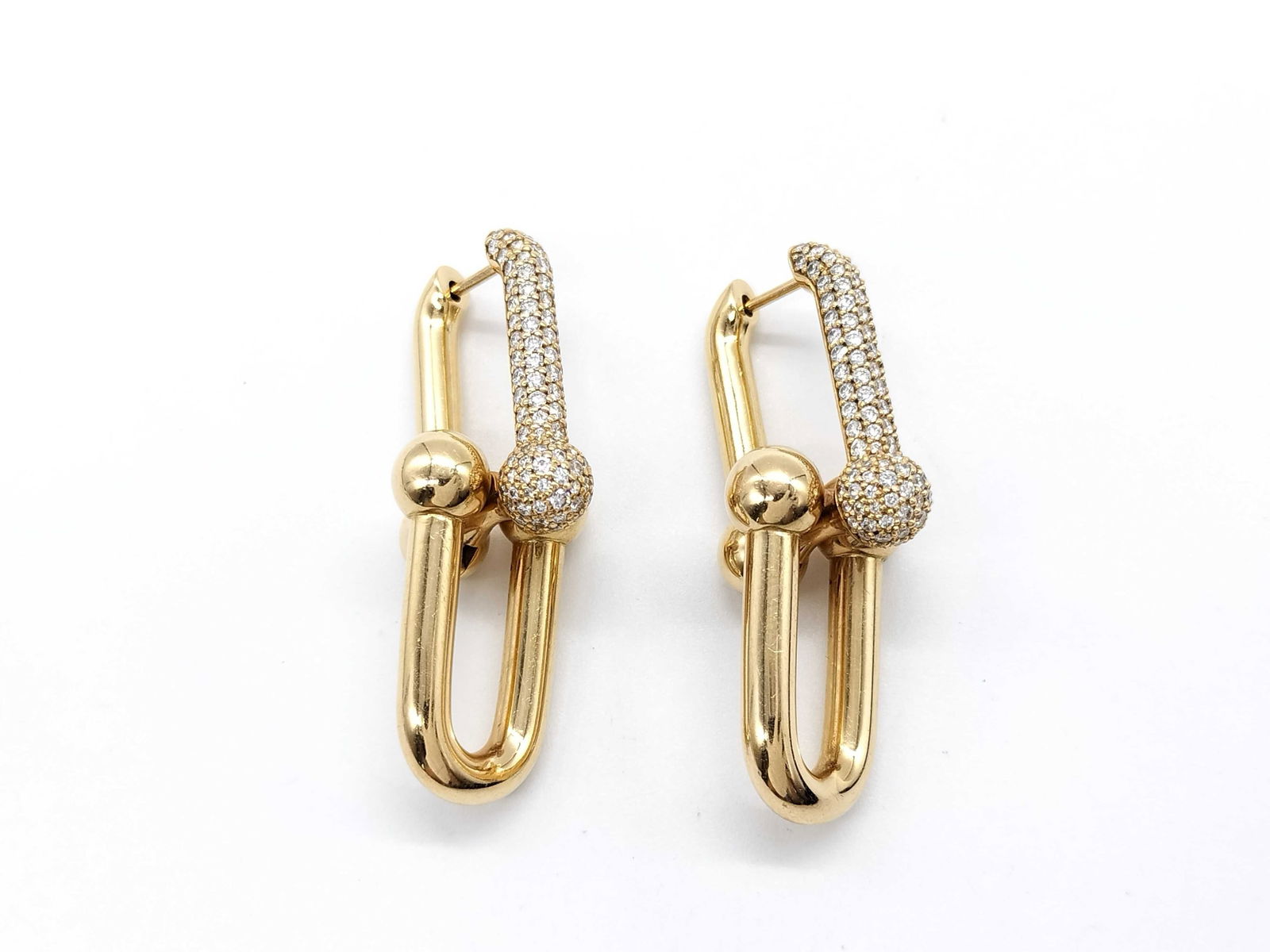 Tiffany & Co. HardWear Large Link Diamond Pave 18K Yellow Gold Earrings: Bold Tiffany & Co. HardWear Large Link earrings crafted in solid 18K yellow gold and accented with pavé-set diamonds. The iconic industrial-inspired link design is enhanced with diamond pavé detaili