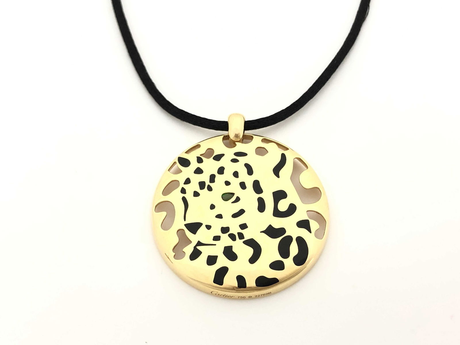 Cartier Panther Black Spotted Leopard 18K Gold & Black Rope Pendant Necklace: Description: This distinctive Cartier Panth?re pendant necklace is crafted in solid 18K gold and features the iconic black spotted leopard motif, showcasing Cartier?s legendary animal design with bold