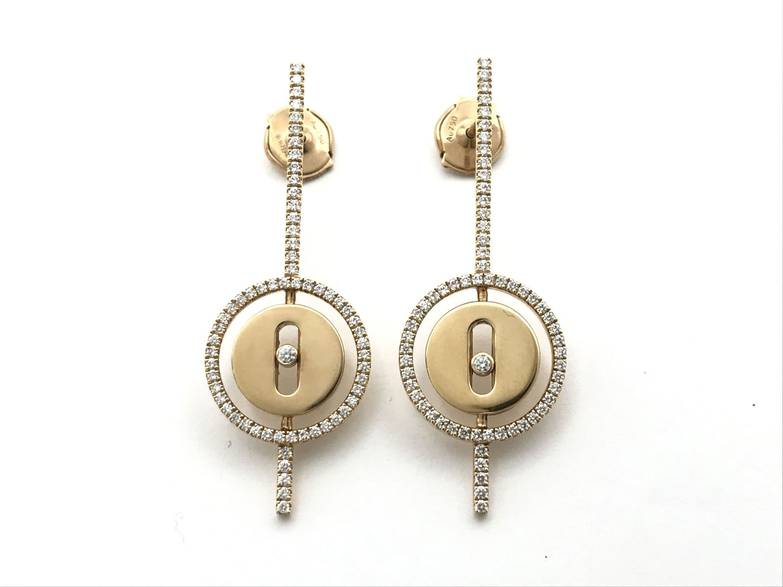 Messika Diamond Pave 18K Rose Gold Drop Earrings: This elegant pair of Messika drop earrings is crafted in solid 18K rose gold and features brilliant pavé-set diamonds in the Maison’s signature contemporary circular design. The refined form reflec