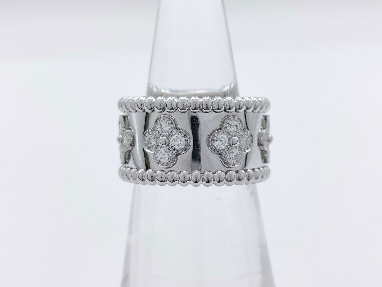 Van Cleef & Arpels Perlee Diamond Clover 18K White Gold Ring: Description: This elegant Van Cleef & Arpels Perlee Clover ring is crafted in solid white 18K gold and features the signature clover motif accented with brilliant diamonds. The refined design highligh