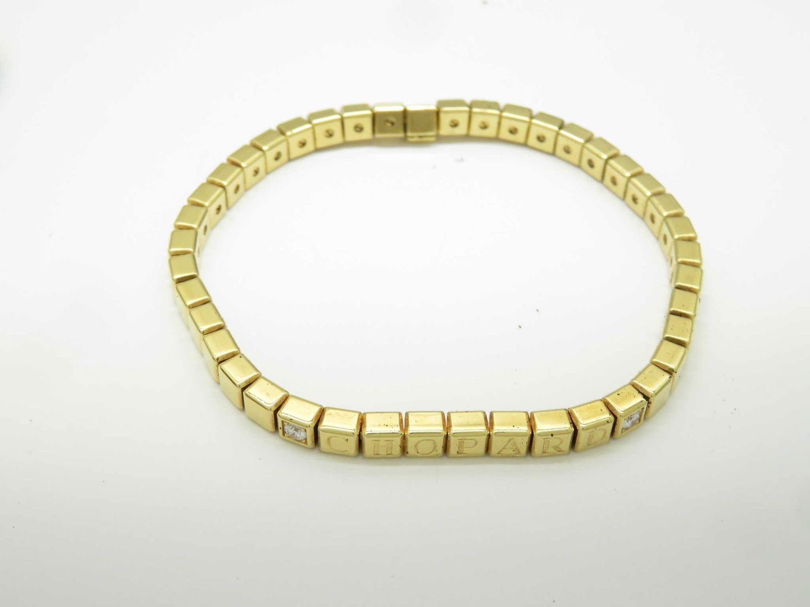 Unique Fancy Geometric Link 18K Yellow Gold Bracelet: Distinctive fancy link bracelet crafted in solid 18K yellow gold, featuring a refined geometric cube-link construction with integrated diamond accents for subtle brilliance. The structured modular des
