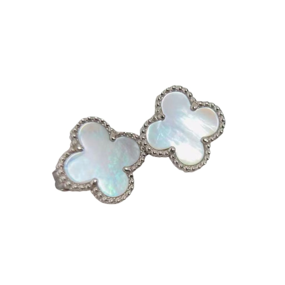 Van Cleef & Arpels Vintage Alhambra White Mother of Pearl 18K White Gold Earrings: Elegant Van Cleef & Arpels Vintage Alhambra earrings crafted in 18K white gold and featuring iconic clover motifs set with luminous white mother of pearl. The soft iridescence of the mother of pearl c