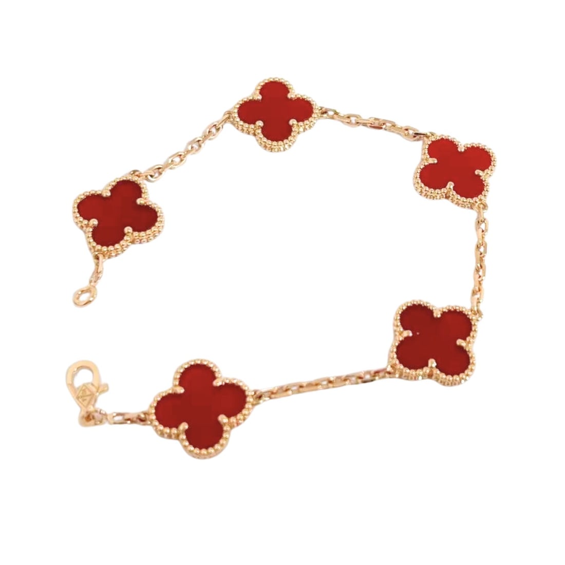 Van Cleef & Arpels Vintage Alhambra Red Carnelian 5 Motif 18K Yellow Gold Bracelet: Elegant Van Cleef & Arpels Vintage Alhambra bracelet crafted in 18K yellow gold and featuring five iconic clover motifs set with rich red carnelian. The deep polished glow of the natural carnelian con