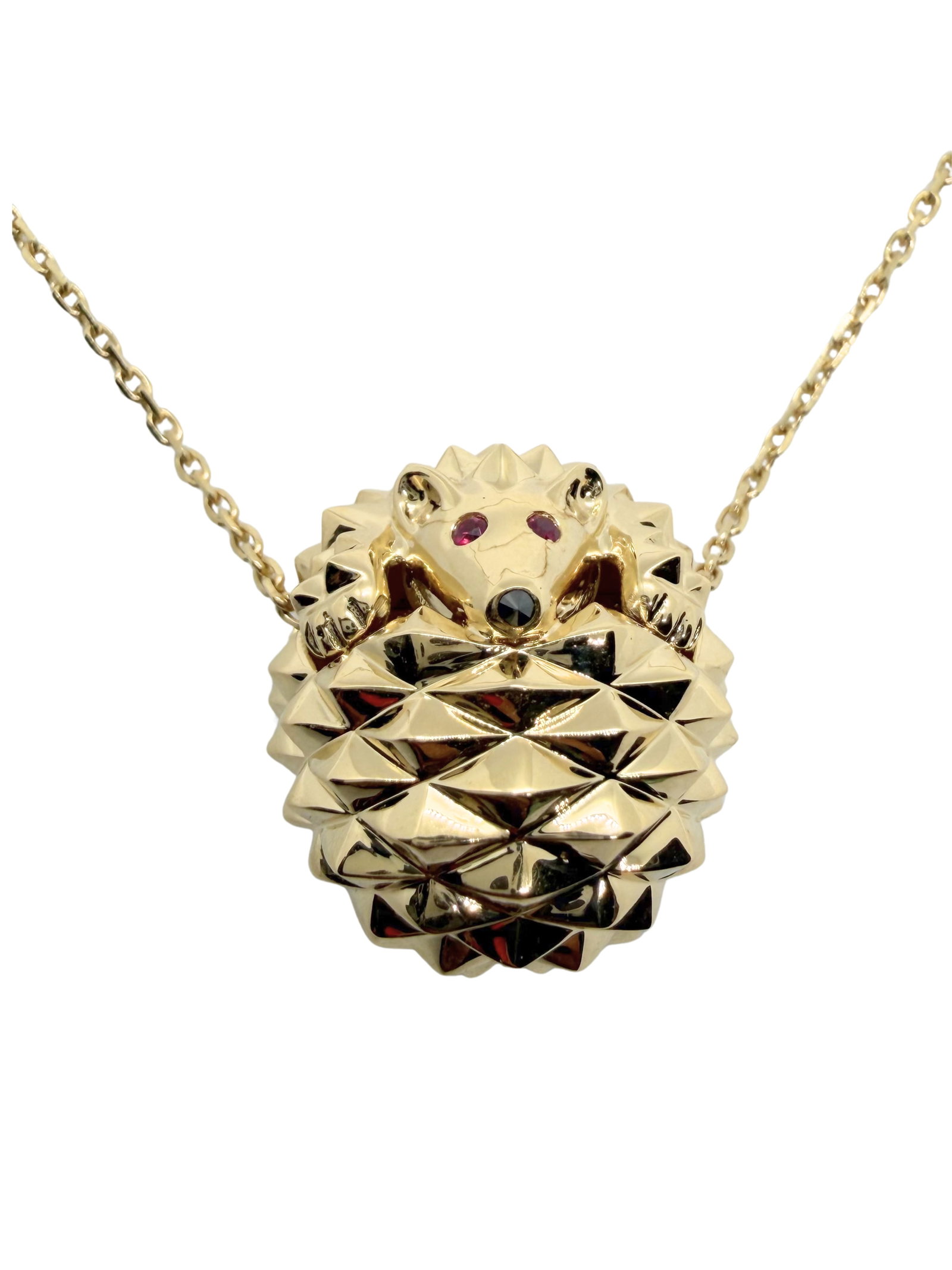 Boucheron Hans the Hedgehog Ruby Eyes Pendant Necklace 18K Yellow Gold: Description: Charming and highly collectible Boucheron Hans the Hedgehog pendant necklace crafted in 18K yellow gold, showcasing the Maison’s whimsical yet refined animal-inspired jewelry design