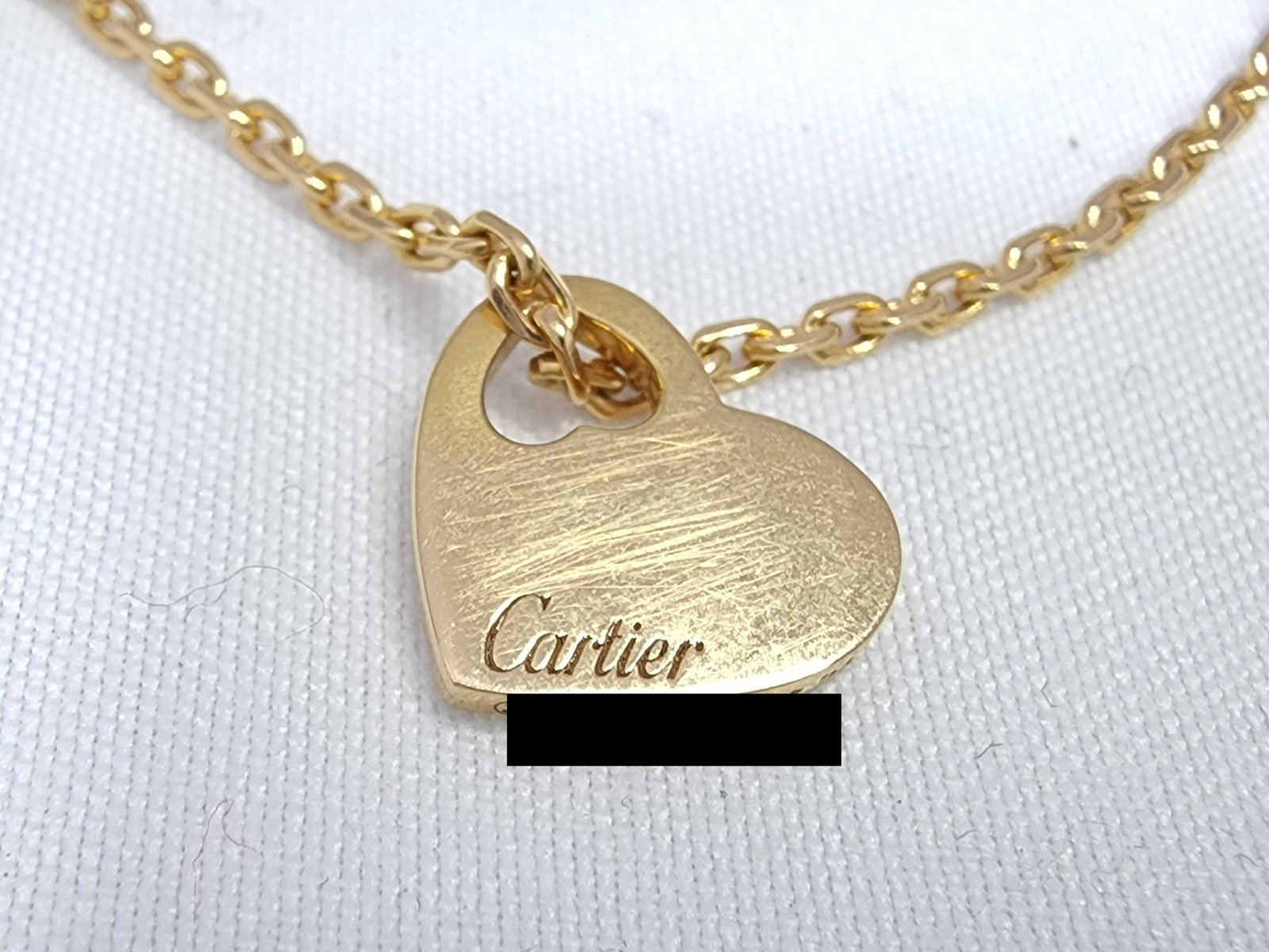 Cartier Heart 18K Yellow Gold Pendant Necklace: Description: Cartier heart pendant necklace crafted in 18K yellow gold. The elegant heart motif features clean lines and timeless styling, creating a versatile design suitable for both everyday wear a