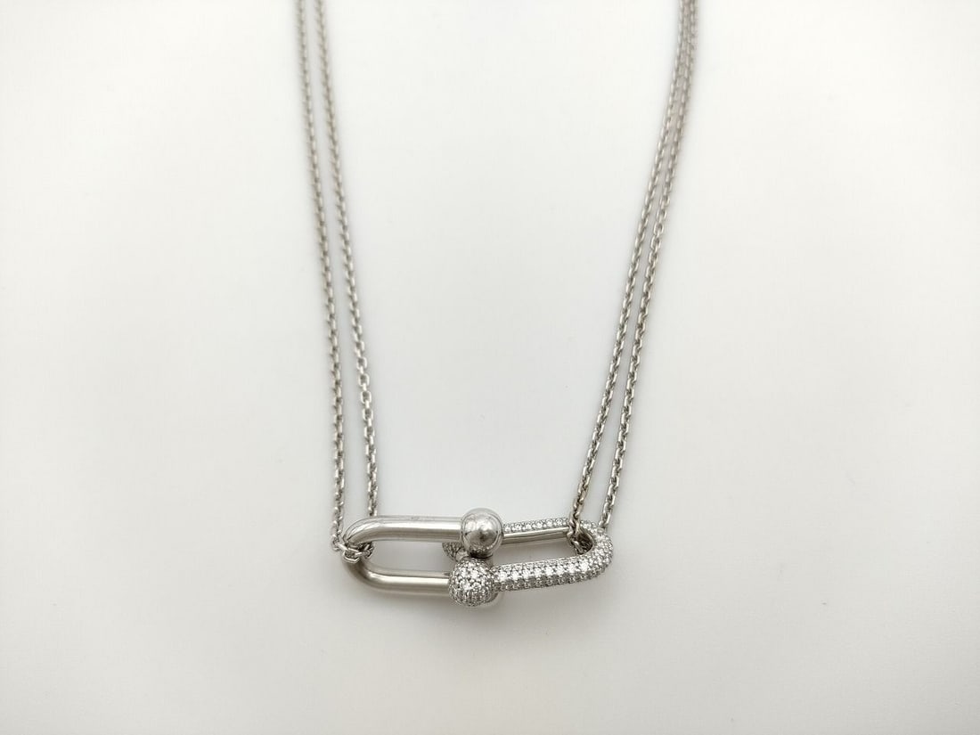 Tiffany & Co. HardWear Double Link Diamond 18K White Gold Pendant Necklace: Description: Sophisticated Tiffany & Co. HardWear necklace crafted in solid 18K white gold and accented with pavé-set diamonds. The design features the iconic double link motif from the