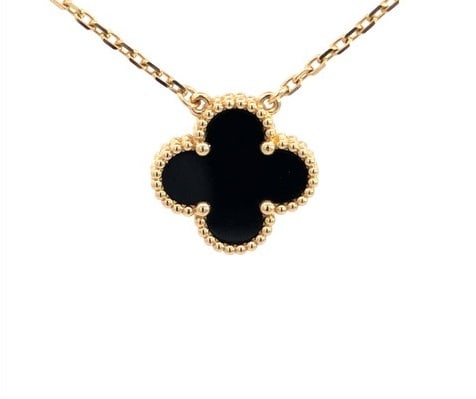Van Cleef & Arpels Vintage Alhambra Black Onyx 18K Yellow Gold Pendant Necklace: Description: Van Cleef & Arpels Vintage Alhambra pendant necklace crafted in 18K yellow gold and featuring the Maison's iconic Alhambra clover motif set with rich black onyx. Inspired by the four 