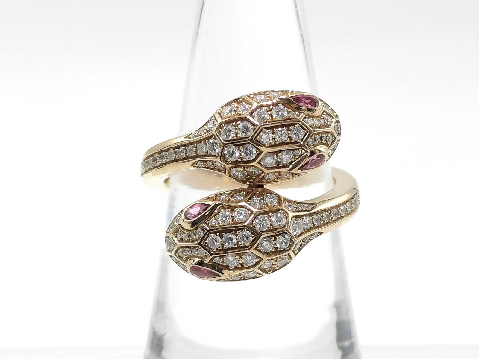 Bvlgari Serpenti Seduttori Diamond Rubellite 18K Rose Gold Ring Size 52: Description: Bvlgari Serpenti Seduttori ring crafted in 18K rose gold and accented with natural diamonds and rubellites. The serpent design combines the brilliance of diamonds with the vibrant color o