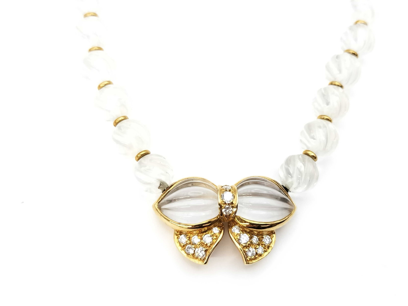 Boucheron Ribbon Motif Quartz Diamond 18K Yellow Gold Vintage Necklace: Description: This elegant Boucheron Ribbon Motif necklace is crafted in solid 18K yellow gold and features carved quartz elements accented by brilliant diamonds in a graceful bow design. The sculptura