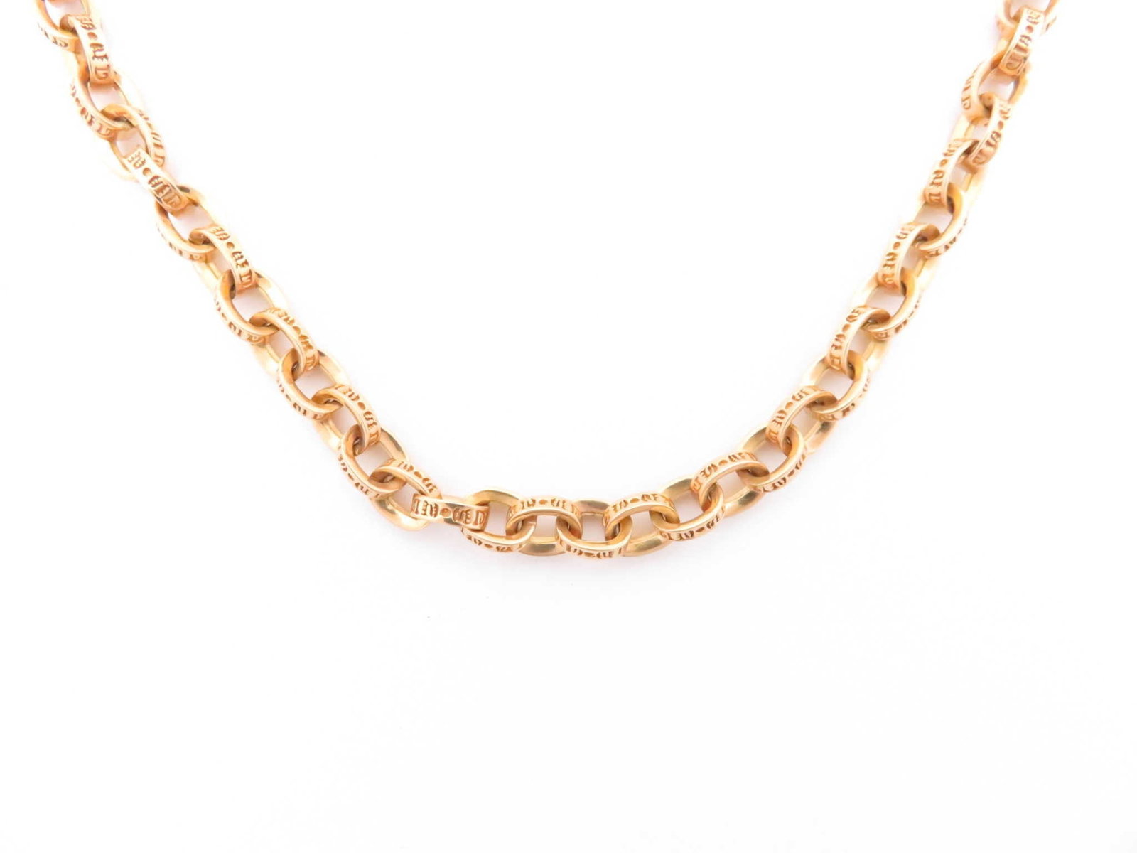 Chrome Hearts Gold Paper Scrolled Cable Link Chain Necklace: Description: Iconic Chrome Hearts paper chain necklace crafted in solid gold, featuring the brand’s signature interlocking elongated link construction with engraved detailing throughout. The bol