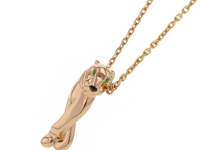 Cartier Panthere Black Lacquer Tsavorite Eyes 18K Rose Gold Pendant Necklace: Description: Striking and highly collectible Cartier Panthere pendant necklace crafted in 18K rose gold, showcasing one of the Maison's most iconic and enduring motifs. The sculptural panther design i