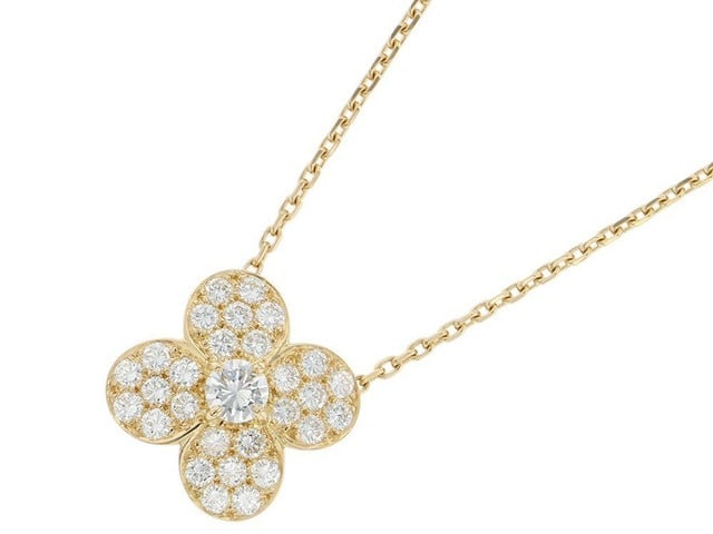 Van Cleef & Arpels Diamond Floral 18K Yellow Gold Vintage Pendant Necklace: Description: Van Cleef & Arpels floral pendant necklace crafted in 18K yellow gold and accented with natural diamonds. Featuring an elegant floral motif, this timeless design reflects the Maison's