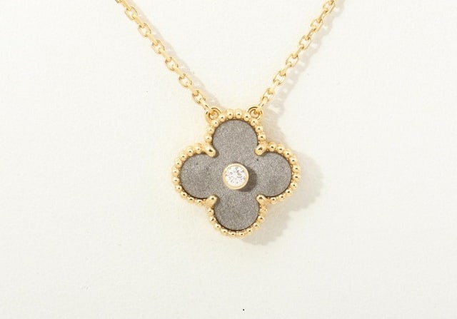 Van Cleef & Arpels Vintage Alhambra 2023 Holiday Edition Silver Obsidian 18K Rose Gold Pendant: Description: Origin / Year: France, 2023 Holiday Edition Provenance: Authenticated with Van Cleef & Arpels through serial number verification, hallmark and engraving review, including