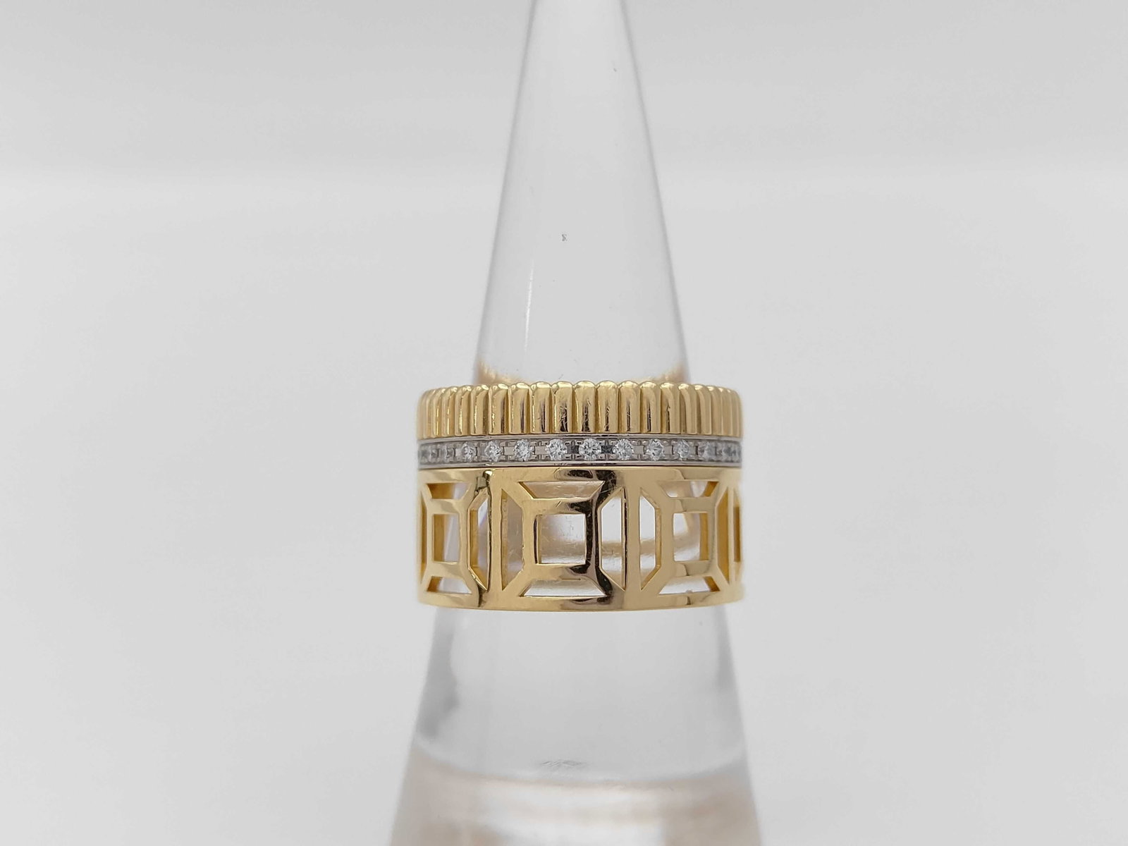 Boucheron Cattle Radiant Openwork Diamond Ring 18K Yellow Gold: Description: This elegant Boucheron Cattle Radiant ring is crafted in solid 18K yellow gold and features brilliant diamond accents set within a distinctive openwork architectural design. The bold scul