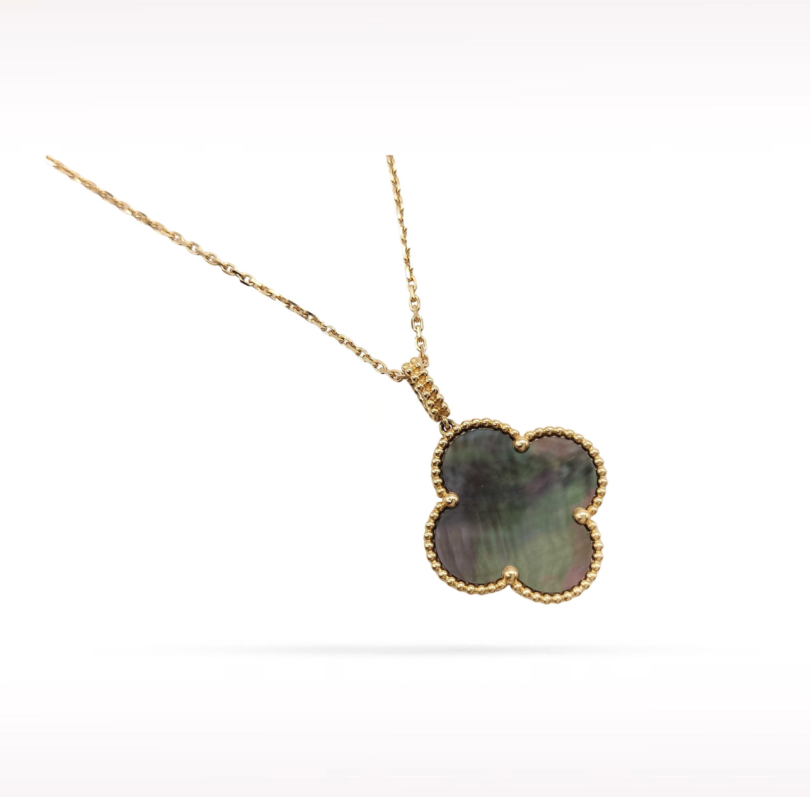 Van Cleef & Arpels Magic Alhambra Black Grey Mother of Pearl 18K Rose Gold Pendant Necklace: Description: Van Cleef & Arpels Magic Alhambra pendant necklace crafted in 18K rose gold and accented with natural black grey mother of pearl. From the iconic Magic Alhambra collection, this elega