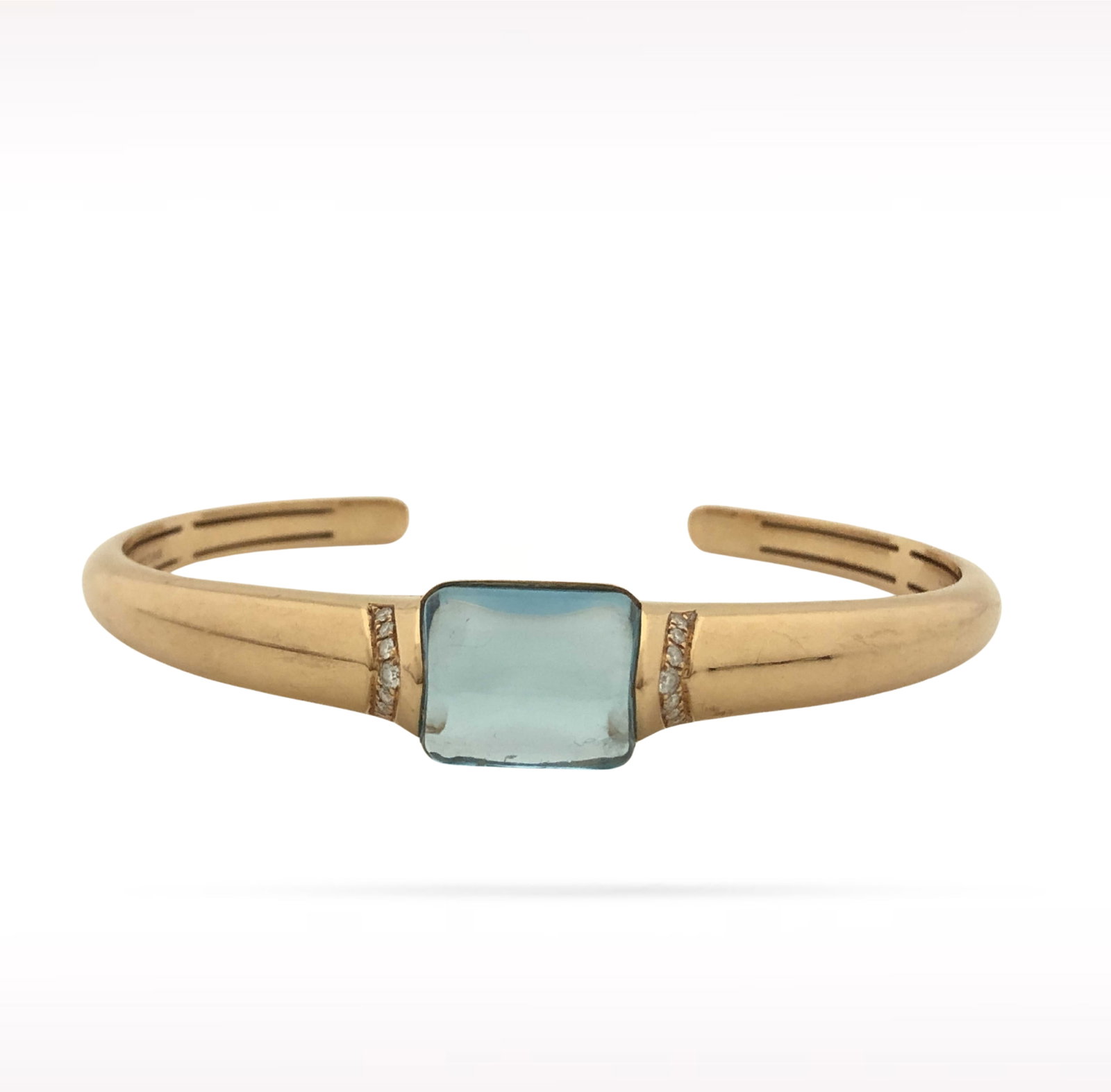Bvlgari Blue Topaz Diamond 18K Rose Gold Bangle Bracelet: Description: Bvlgari bangle bracelet crafted in 18K rose gold and accented with natural diamonds and a vibrant blue topaz. Combining the warmth of rose gold with the brilliance of diamonds and the ric