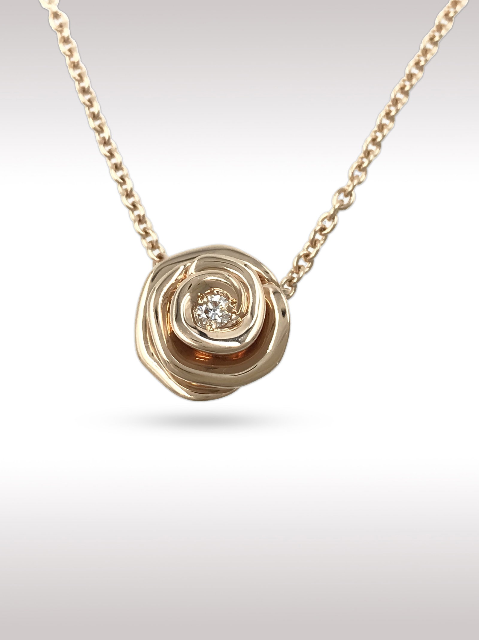 Dior Rose Flower Diamond 18K Rose Gold Large Pendant Necklace: Description: Elegant Dior rose flower pendant necklace crafted in 18K rose gold, featuring a sculptural blooming rose design with soft layered curves. At the center sits a brilliant cut diamond, addin