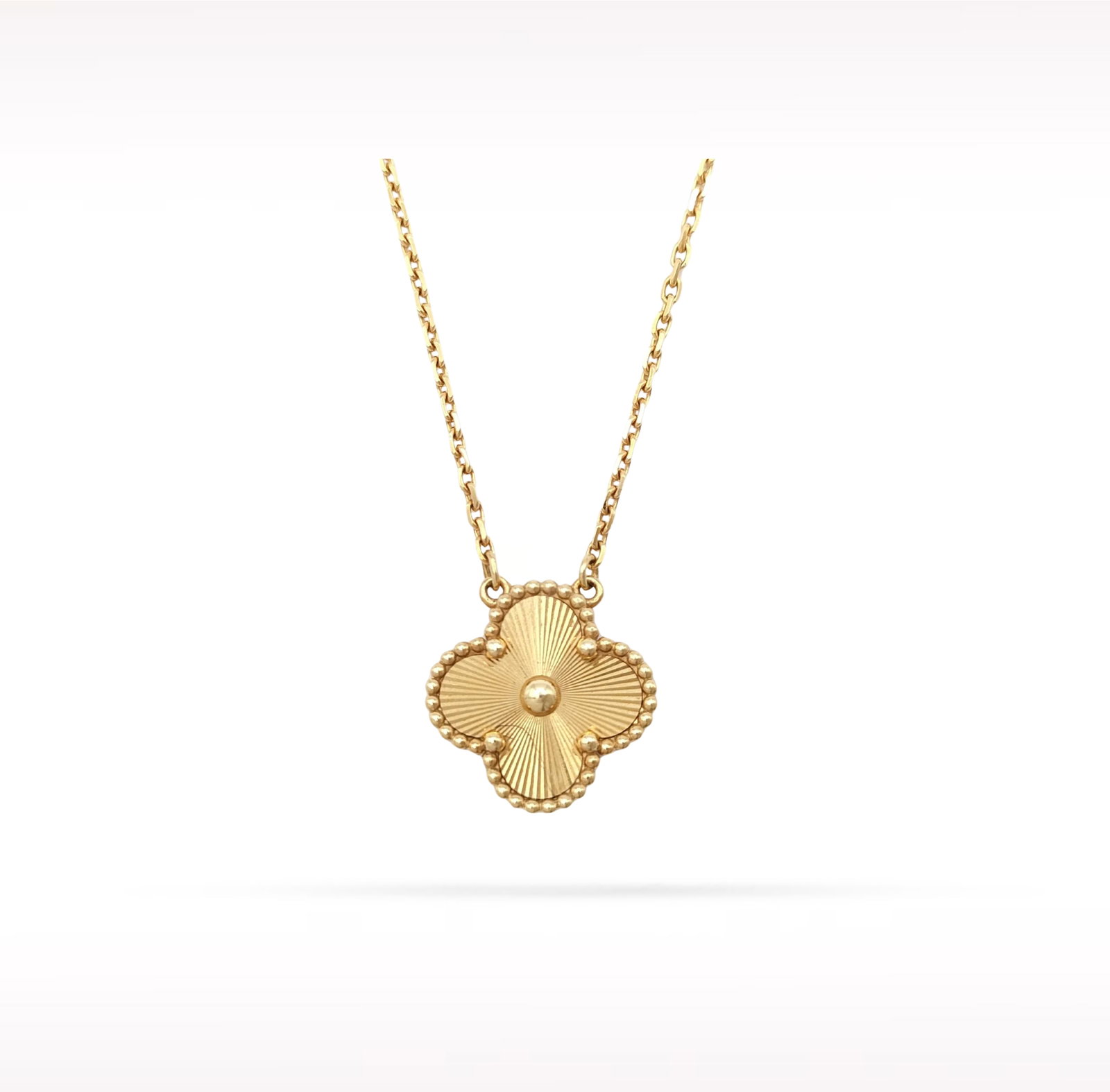 Van Cleef & Arpels Vintage Alhambra Guilloche 18K Yellow Gold Pendant Necklace: Description: Van Cleef & Arpels Vintage Alhambra pendant necklace crafted in 18K yellow gold and featuring an exquisite guilloche motif. From the iconic Vintage Alhambra collection, this elegant p