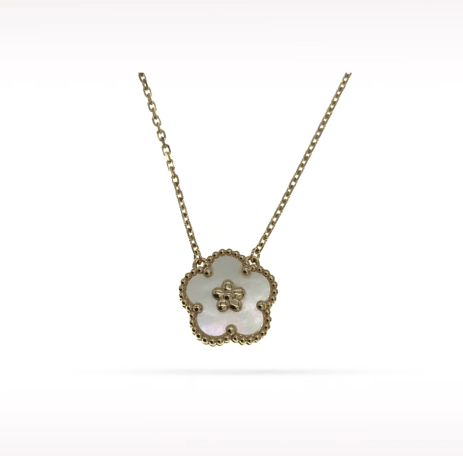 Van Cleef & Arpels Lucky Spring Plum Blossom White Mother of Pearl 18K Rose Gold Pendant Necklace: Description: Van Cleef & Arpels Lucky Spring Plum Blossom pendant necklace crafted in 18K rose gold and accented with natural white mother of pearl. From the enchanting Lucky Spring collection, th
