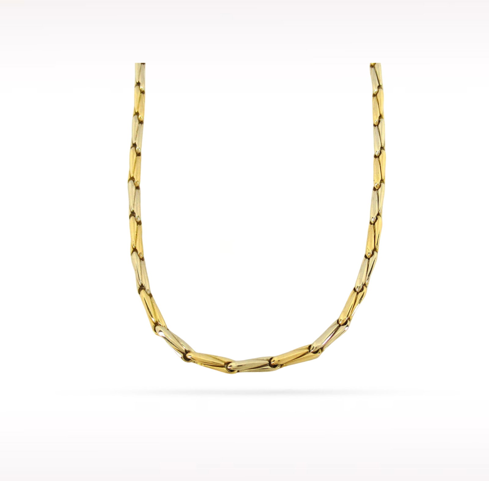 Cartier Vintage Two Tone Marquise Fancy Link 18K Yellow White Gold Necklace: Description: Cartier Vintage necklace crafted in 18K yellow and white gold. Featuring a distinctive two tone marquise shaped fancy link design, this elegant necklace blends timeless vintage styling wi