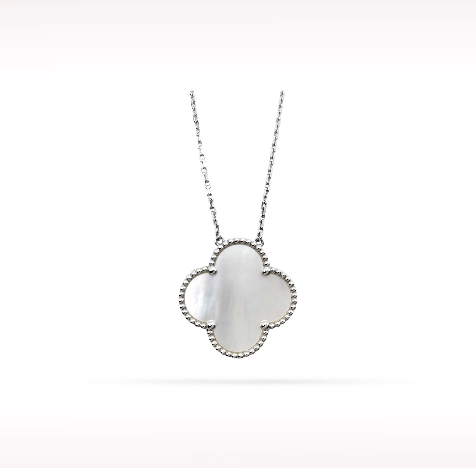 Van Cleef & Arpels Magic Alhambra White Mother of Pearl 18K White Gold Pendant Necklace: Description: Van Cleef & Arpels Magic Alhambra pendant necklace crafted in 18K white gold and accented with natural white mother of pearl. From the iconic Magic Alhambra collection, this elegant p