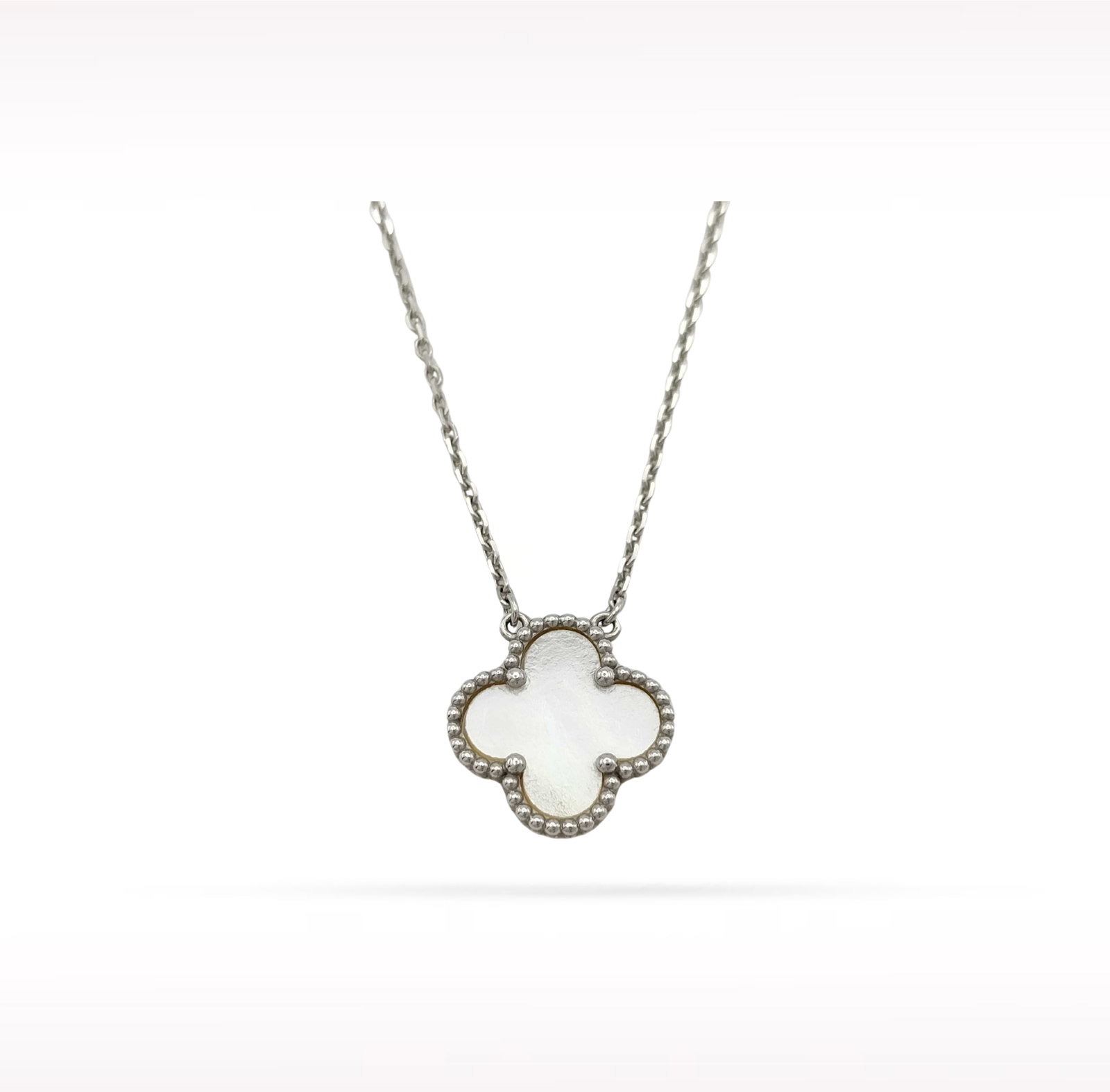 Van Cleef & Arpels Vintage Alhambra White Mother of Pearl 18K White Gold Necklace: Description: Van Cleef & Arpels Alhambra necklace crafted in 18K white gold and accented with natural white mother of pearl. From the iconic Alhambra collection, this elegant necklace features the